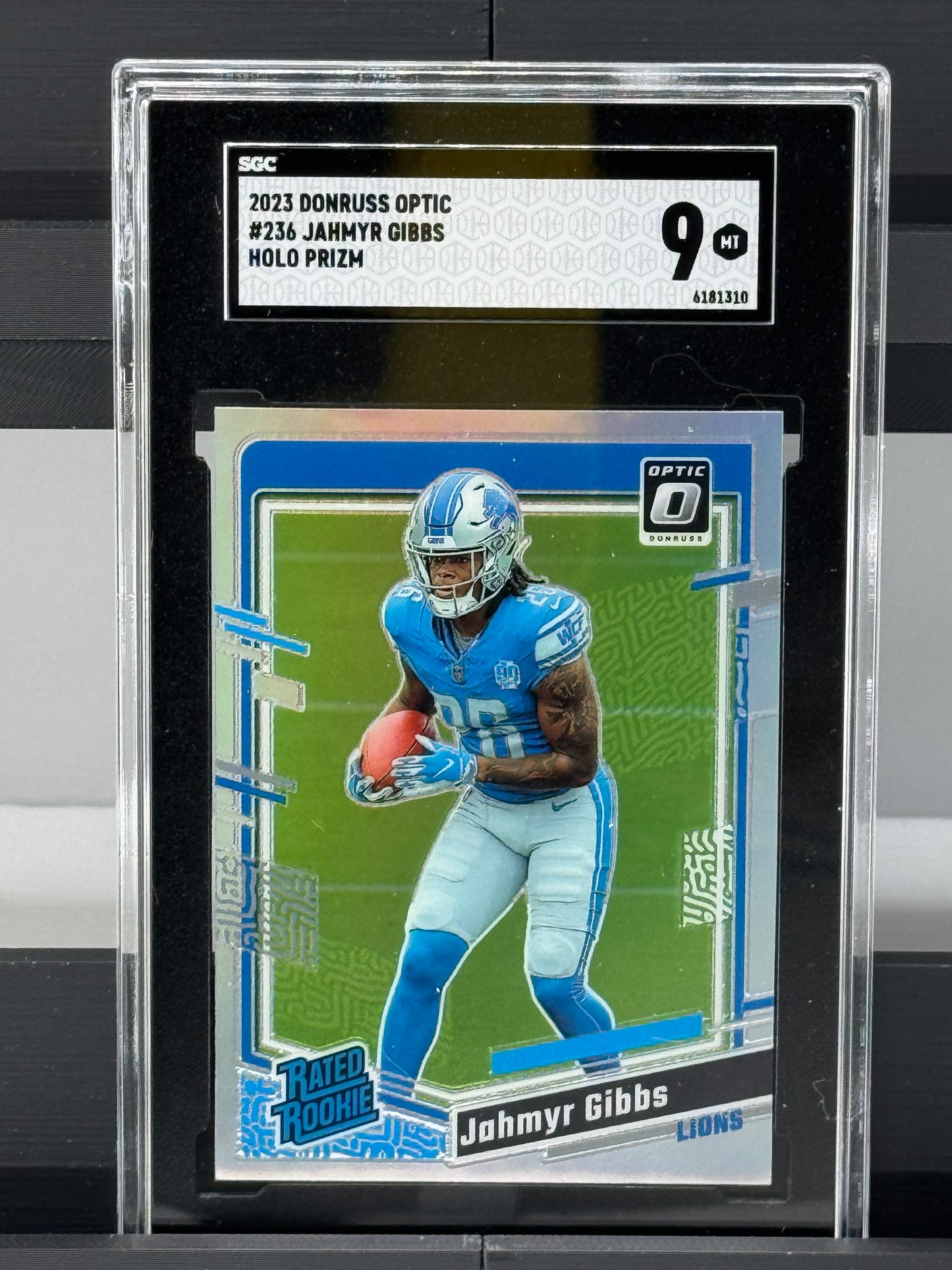 2023 Donruss Optic #236 Jahmyr Gibbs Holo Prizm RC SGC 9 Detroit Lions
