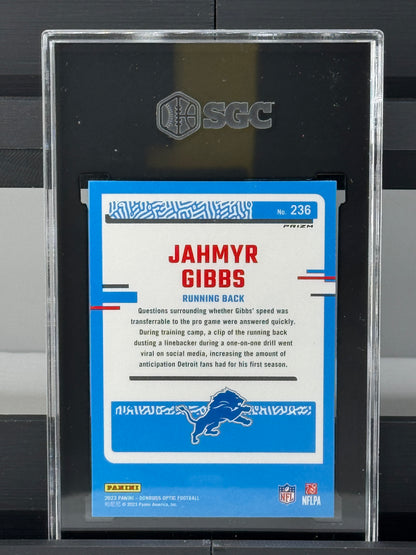 2023 Donruss Optic #236 Jahmyr Gibbs Holo Prizm RC SGC 9 Detroit Lions
